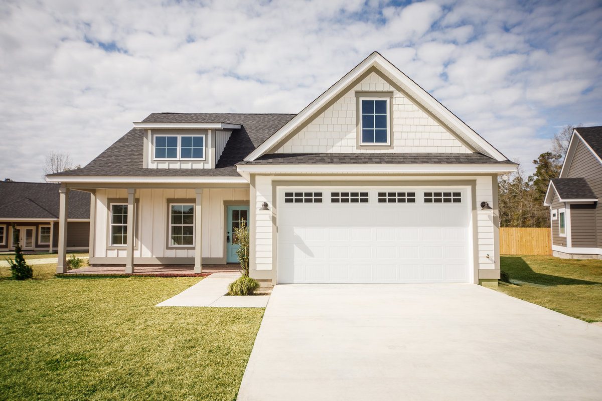 One Story House With a Driveway and Fiber Cement Siding