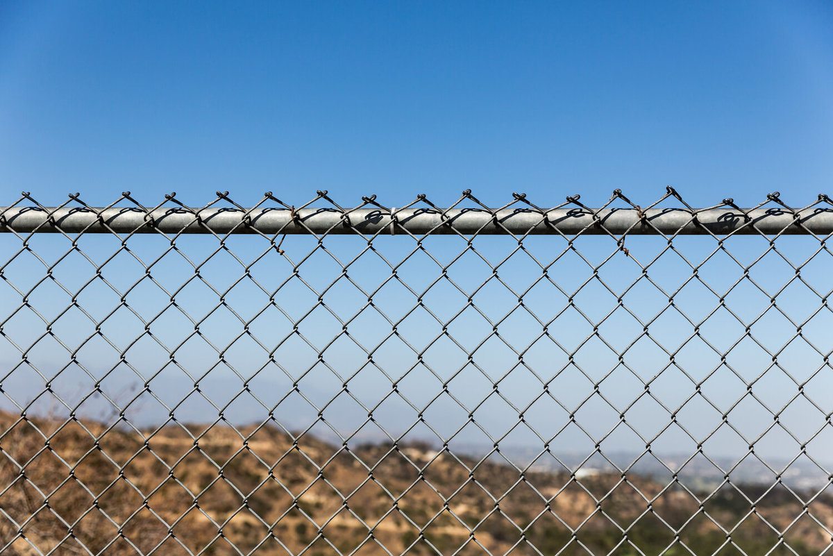 Chain Link Fence With the Sky at the Background