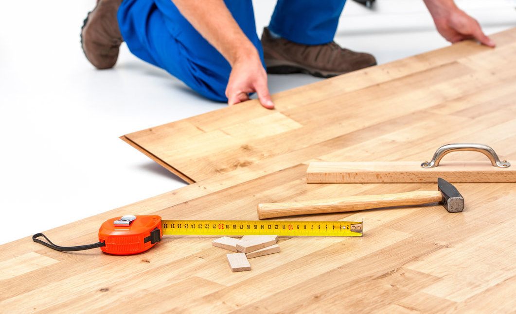 Worker Installing Hardwoood Floor