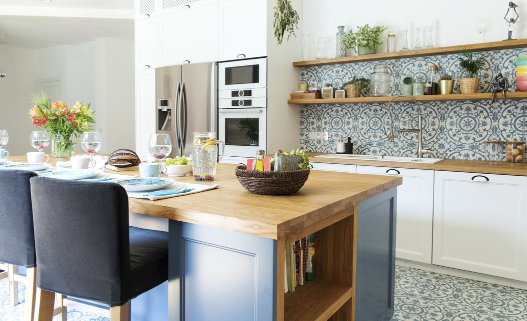 Mediterranean Kitchen Design with Blue Tile Backsplash and Wooden Table