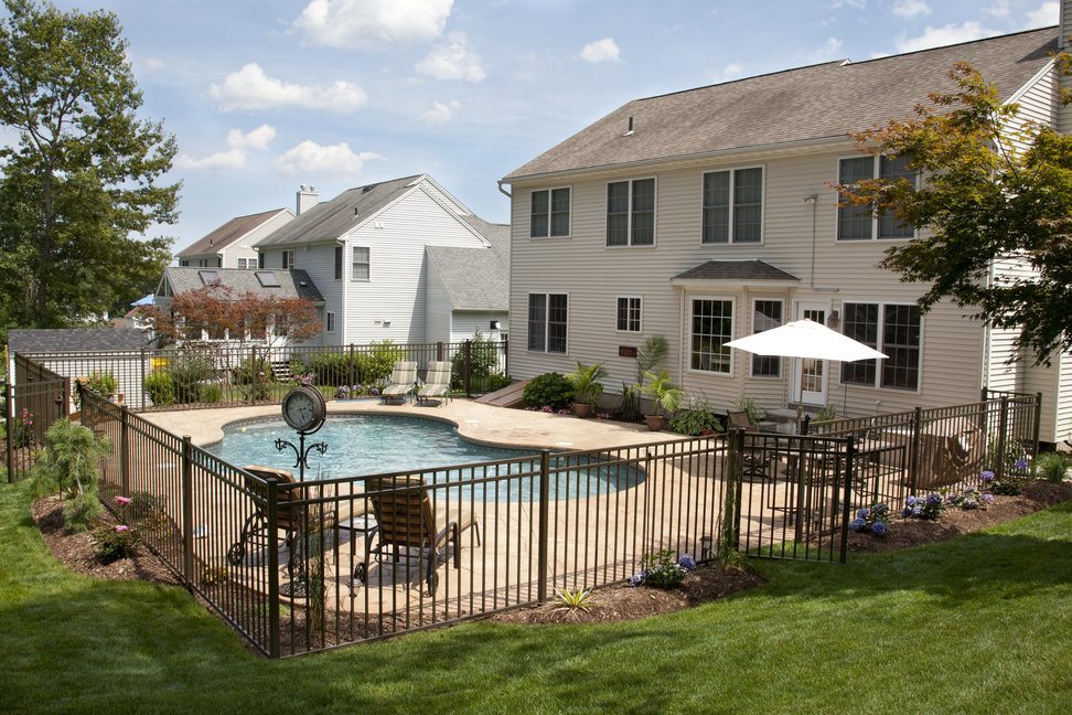 Bronze metal fencing around a pool area