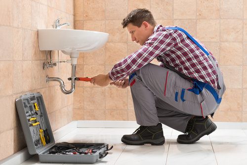 Image result for picture of a plumber