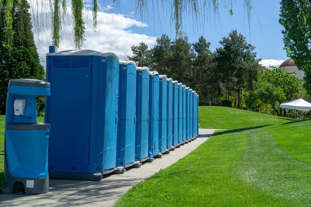 Blue Rented Portable Toilets in a Line