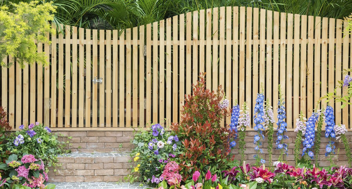 Pine Fence Installed in a Flower Garden