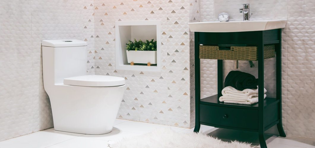 Modern white bathroom with one piece toilet